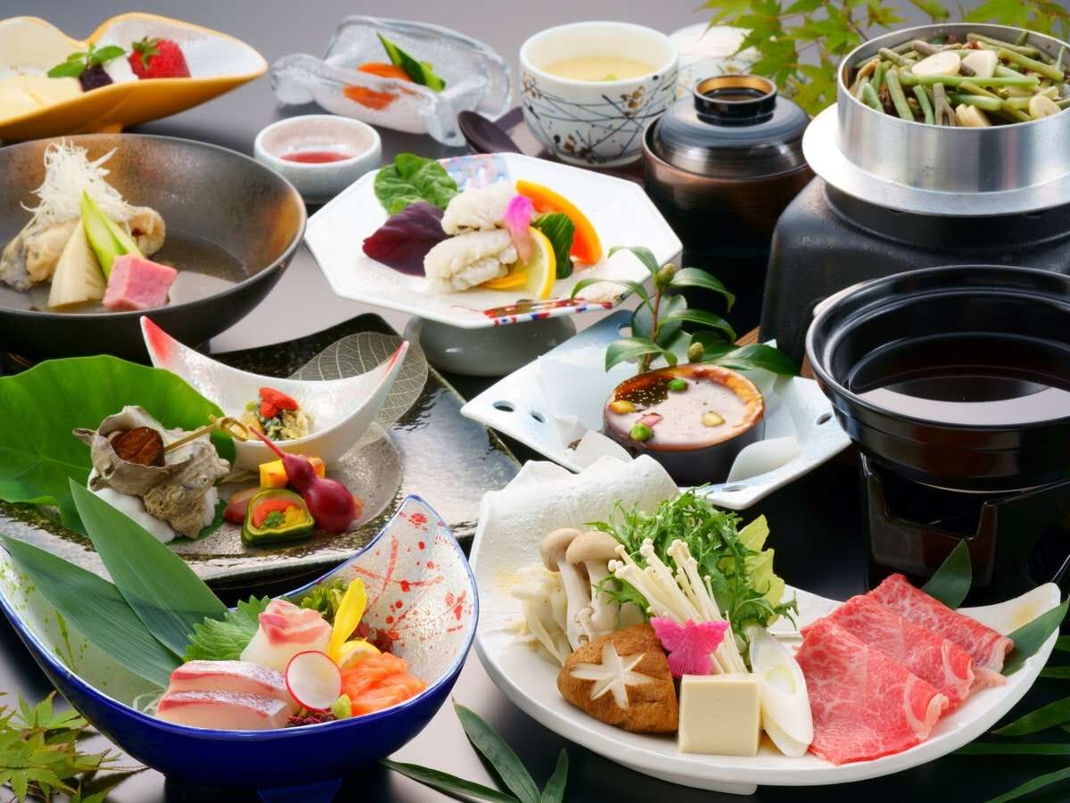A variety of dishes and hot pot setup, likely for a dining experience.