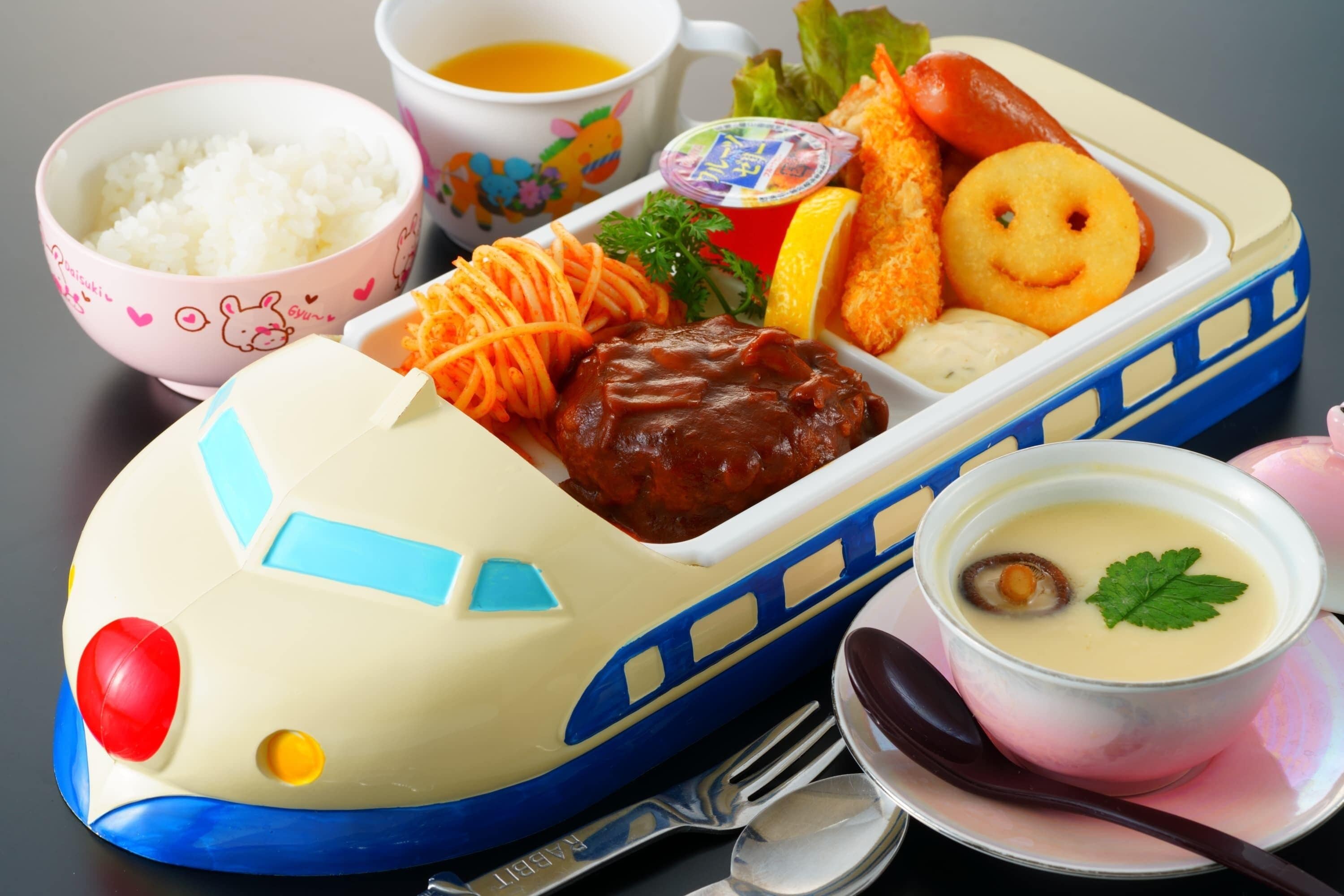 A meal tray with rice, soup, and various side dishes.