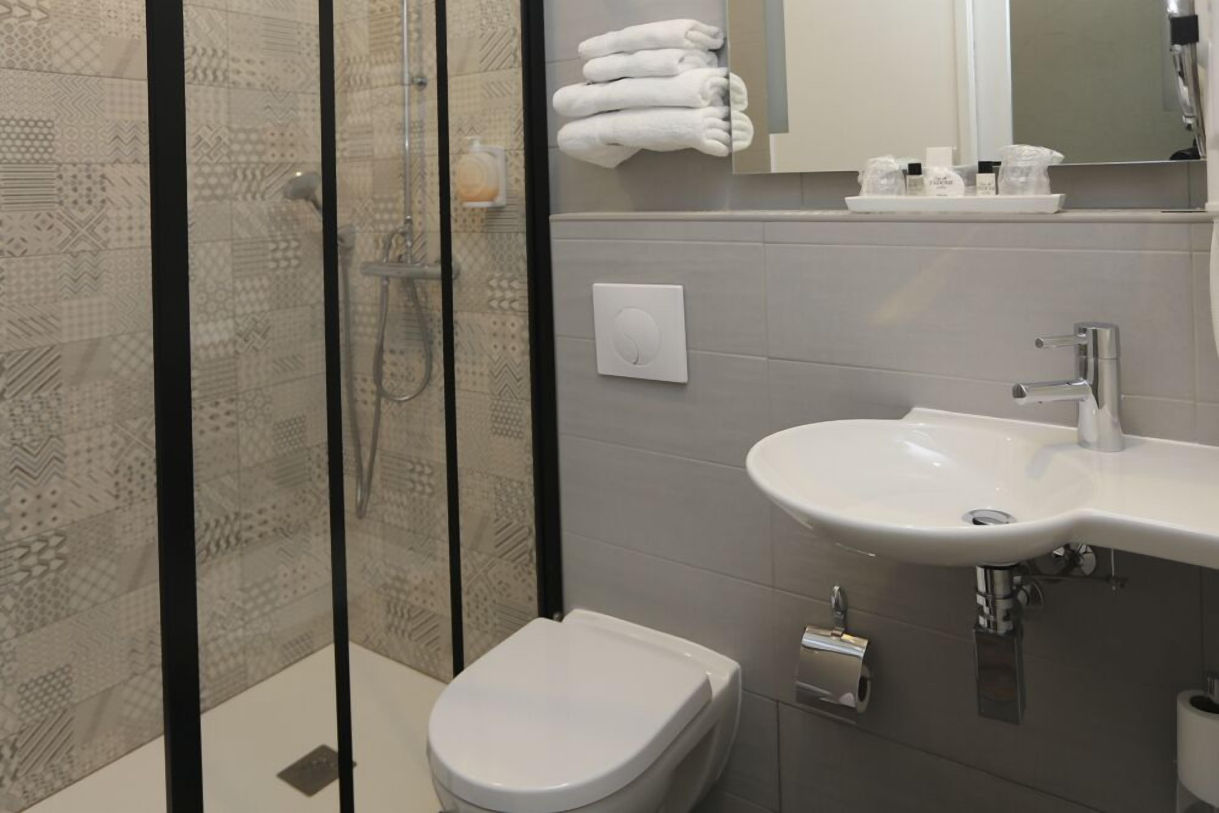 superior double room | bathroom | shower, free toiletries, hair dryer, towels