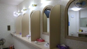 A bathroom with multiple mirrors, a sink, and a fan. - Shirahama Onsen Minshuku A Course (Shirahama)