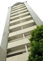 A tall building with multiple balconies.