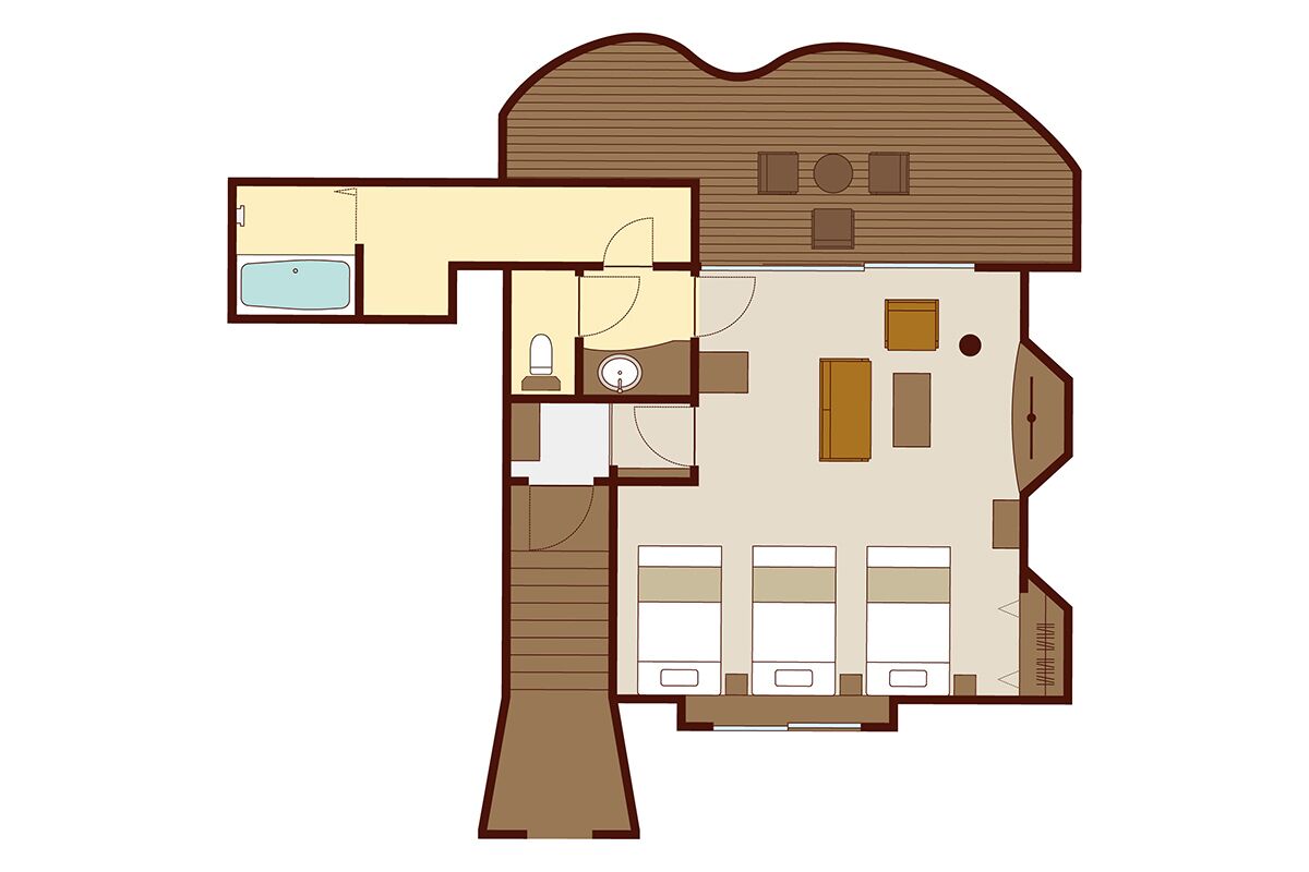 A floor plan of a hotel with a central living area, a kitchen, a bathroom, and a separate bedroom area.