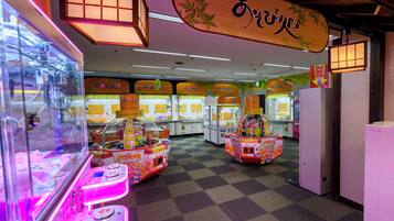 Enjoy games and entertainment in this lively arcade area with claw machines and other gaming options.