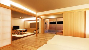 A modern hotel room with a wooden floor, a bed, a TV, a desk, and a sliding door leading to a shower area. - Ryokan Yubara International Tourist HOT (MANIWA SHI)
