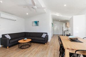 Deluxe Poolside Accessible 2 Bedroom Cabin | Living area | TV, DVD player - Victor Harbor Holiday Park (Victor Harbor)