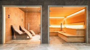 A modern spa area with two massage chairs and a wooden bench. - HOVIMA Cool Costa Adeje (Adeje)