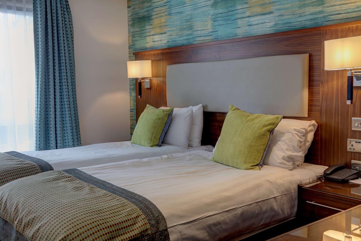 Premium bedding, desk, laptop workspace, iron/ironing board