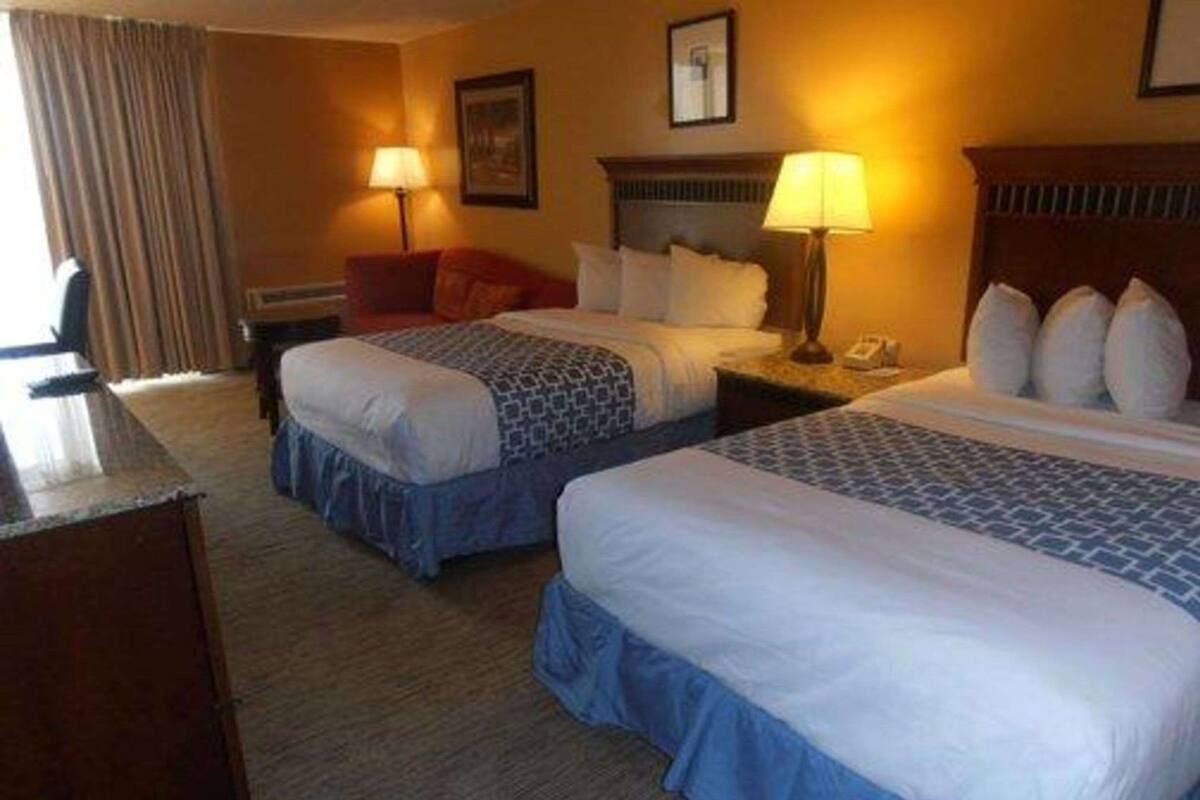 Desk, laptop workspace, blackout drapes, iron/ironing board