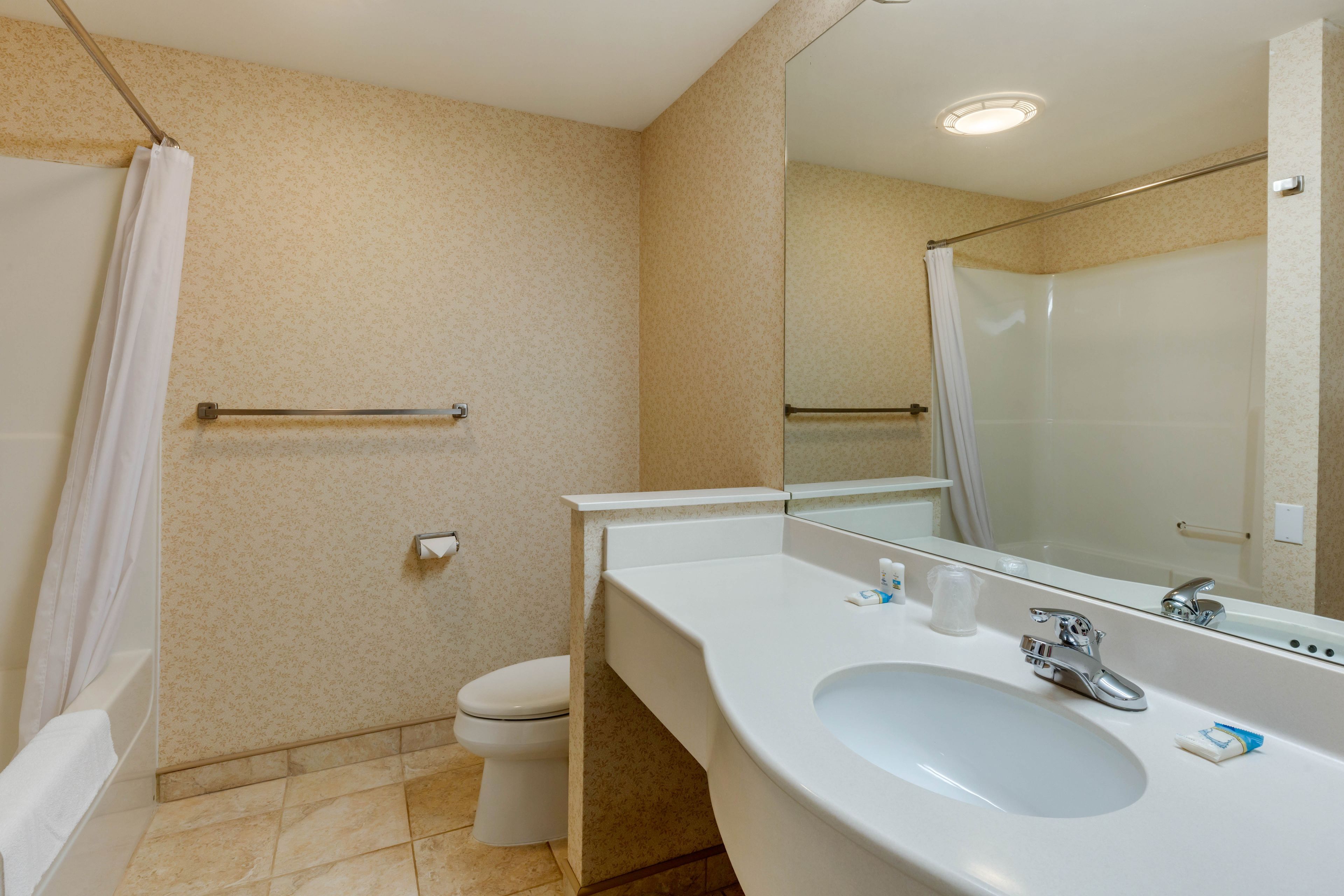 room, 1 king bed, jetted tub | bathroom | combined shower/bathtub, hair dryer, towels, soap