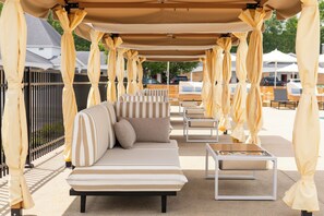 Seasonal outdoor pool, open 9:00 AM to 9:00 PM, free cabanas