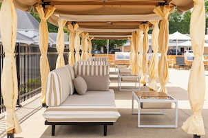 Seasonal outdoor pool, open 9:00 AM to 9:00 PM, free cabanas