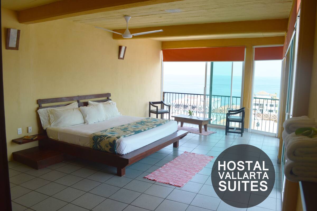 Suite, 1 cama King size, vista a la bahía | Caja de seguridad en la habitación y tabla de planchar con plancha 