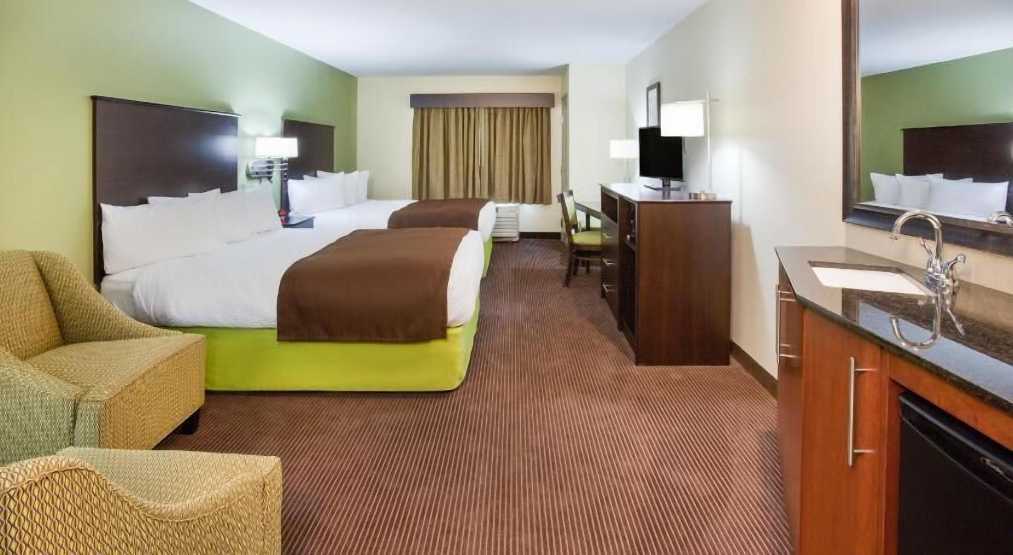 Premium bedding, desk, laptop workspace, blackout curtains