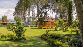 Stroll through the beautifully manicured lawn surrounded by a variety of trees and buildings with unique architectural styles.