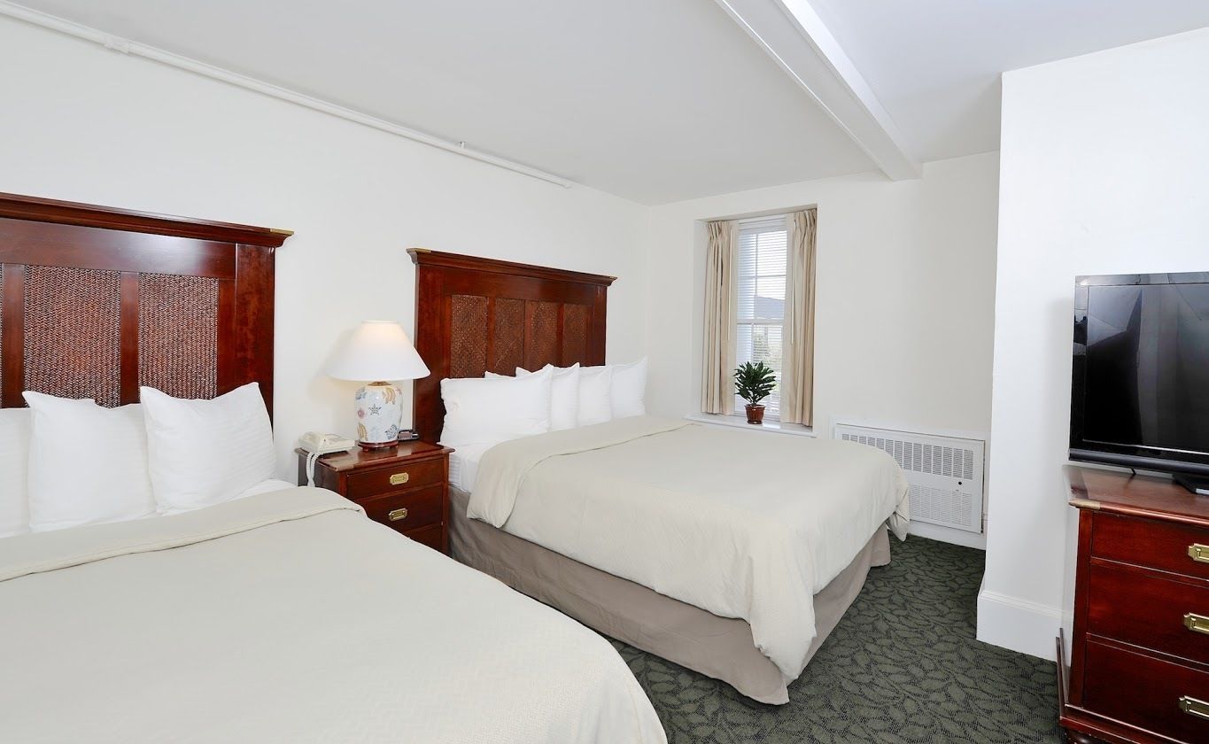 deluxe room, 2 queen beds | desk, iron/ironing board, free cots/infant beds, free wifi