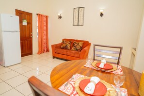 Deluxe Suite, 1 King Bed | Living area | Flat-screen TV - Connie's Comfort Suites (St. John's)