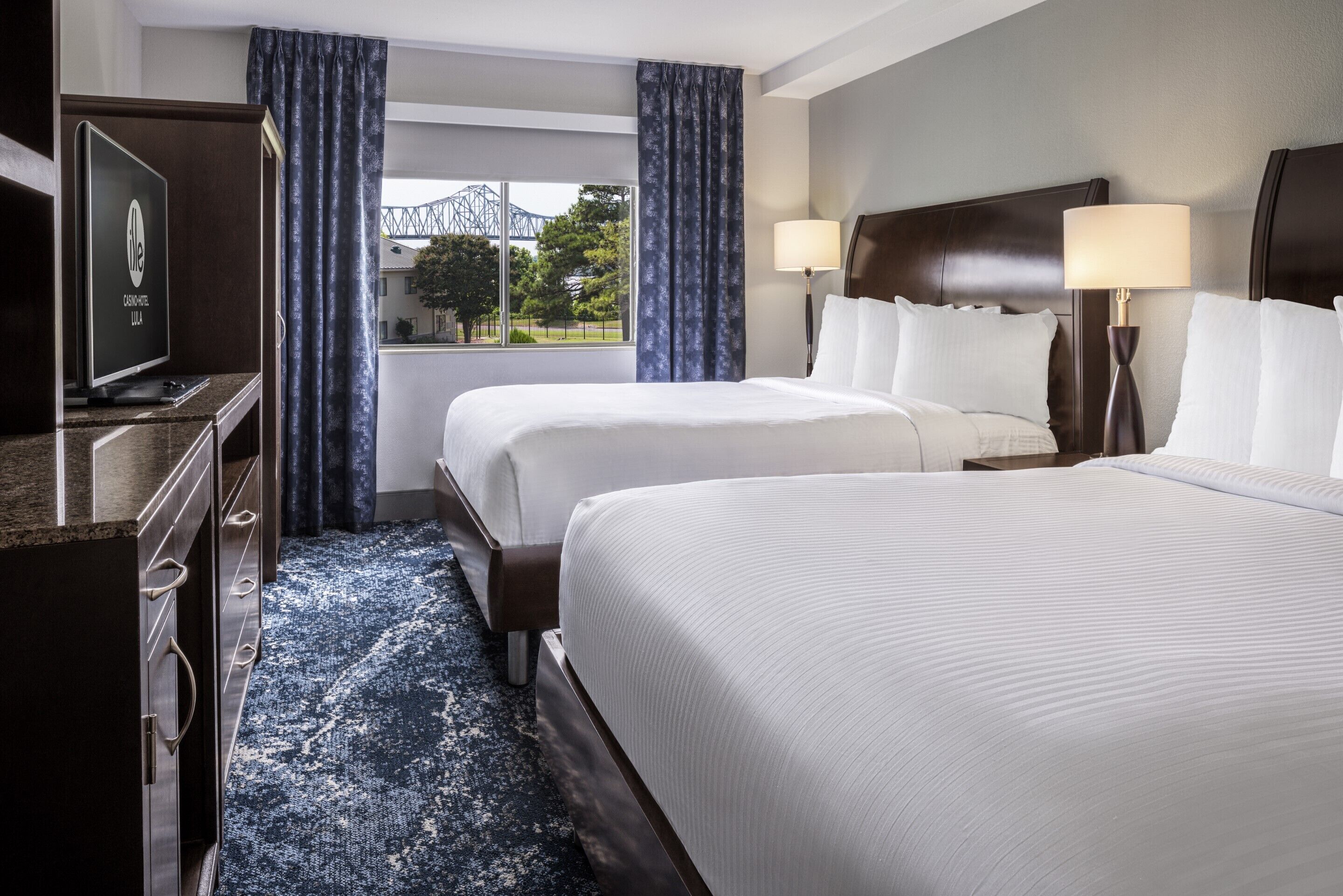 Desk, blackout drapes, bed sheets