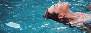 A person swimming in a pool. - Isle Casino Hotel Lula Hotel & Casino - A Caesars Rewards Destination (Lula)