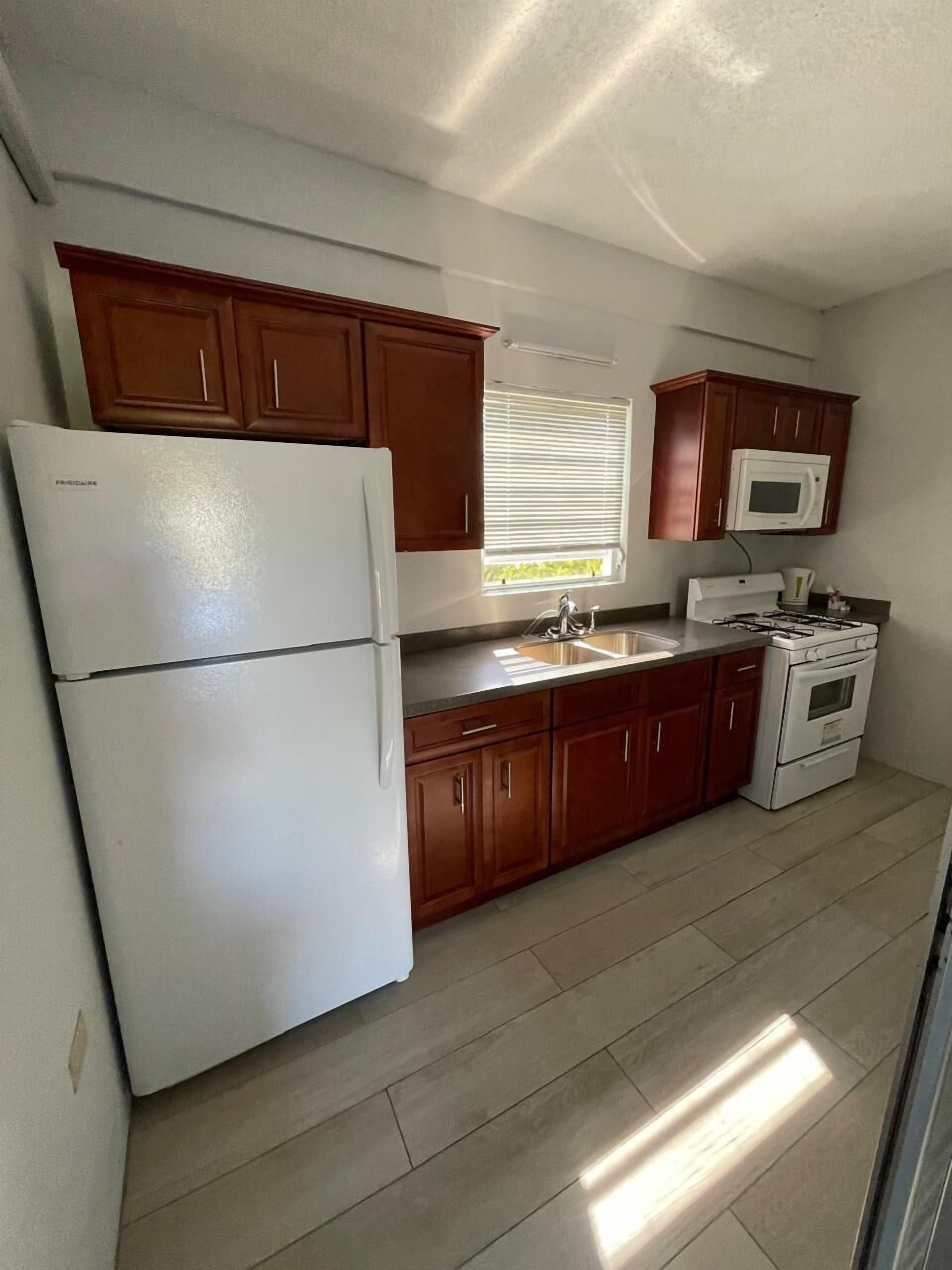 one bedroom with full kitchen | private kitchen | full-sized fridge, microwave, oven, electric kettle