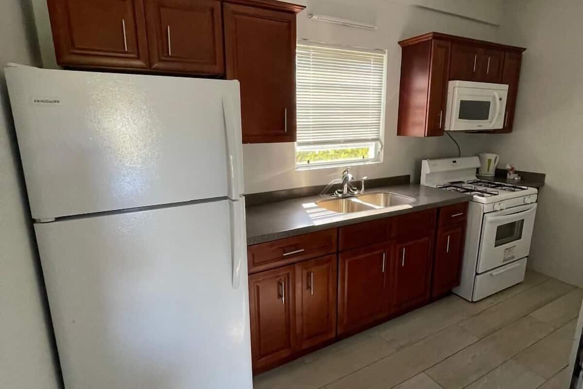 one bedroom with full kitchen | private kitchen | full-sized fridge, microwave, oven, electric kettle