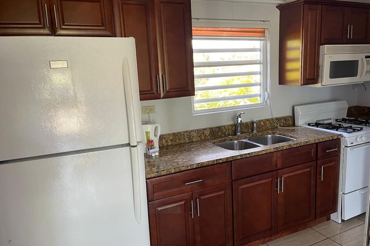 one bedroom with full kitchen | private kitchen | full-sized fridge, microwave, oven, electric kettle