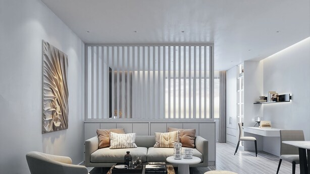 Una sala moderna con un sofá gris, una mesa de centro y un comedor con una mesa y sillas blancas.