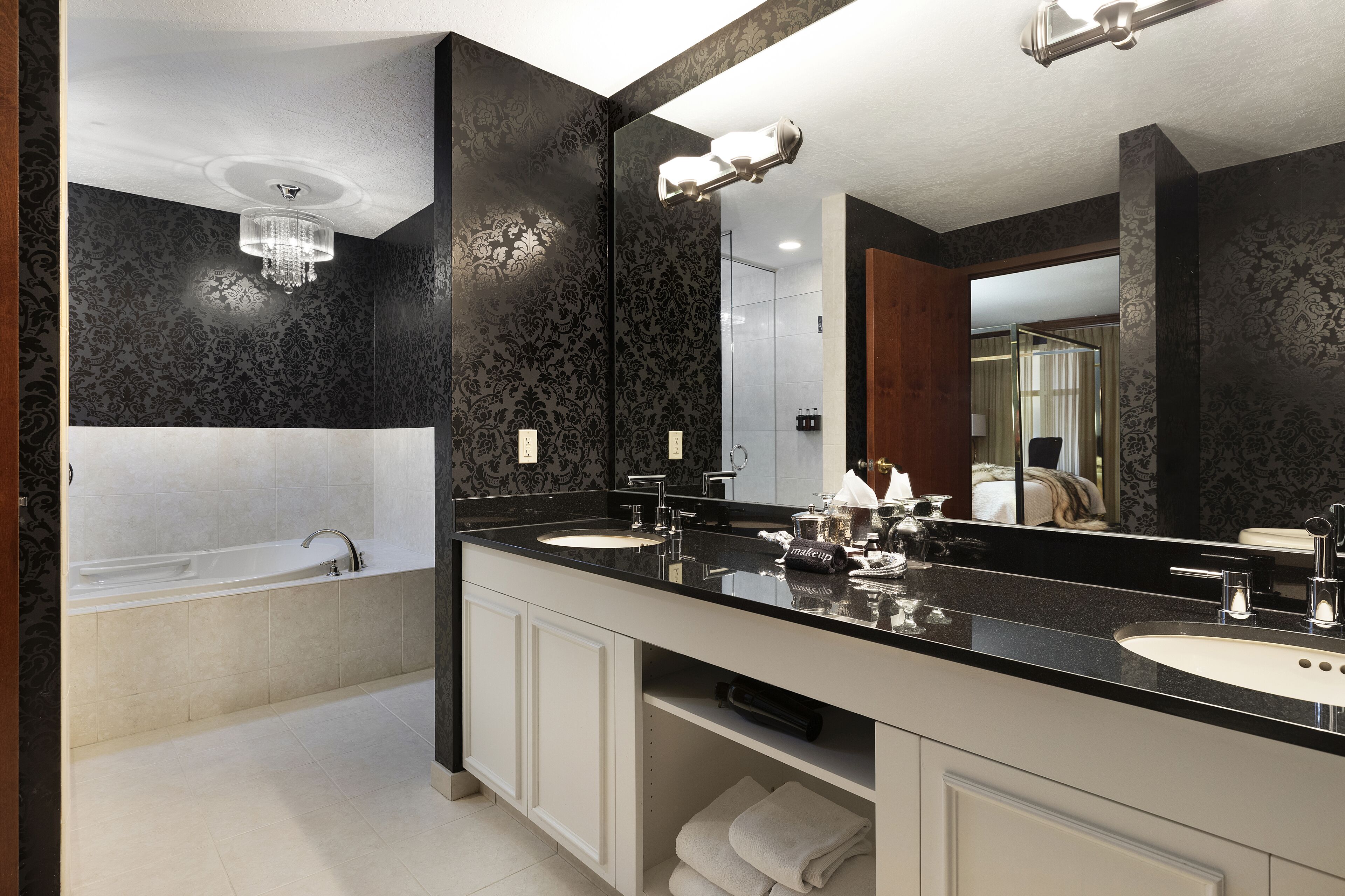 designer toiletries, hair dryer, towels, soap