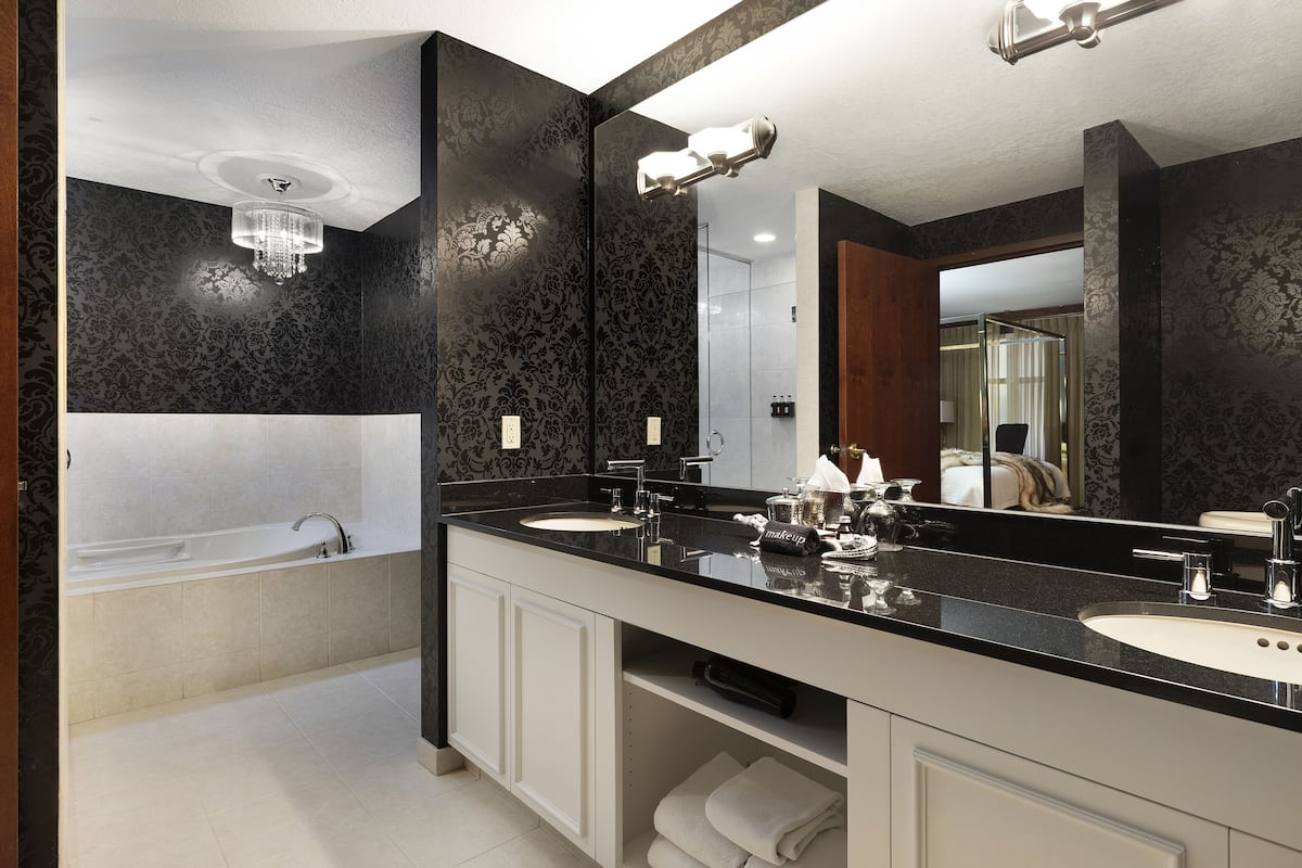 designer toiletries, hair dryer, towels, soap