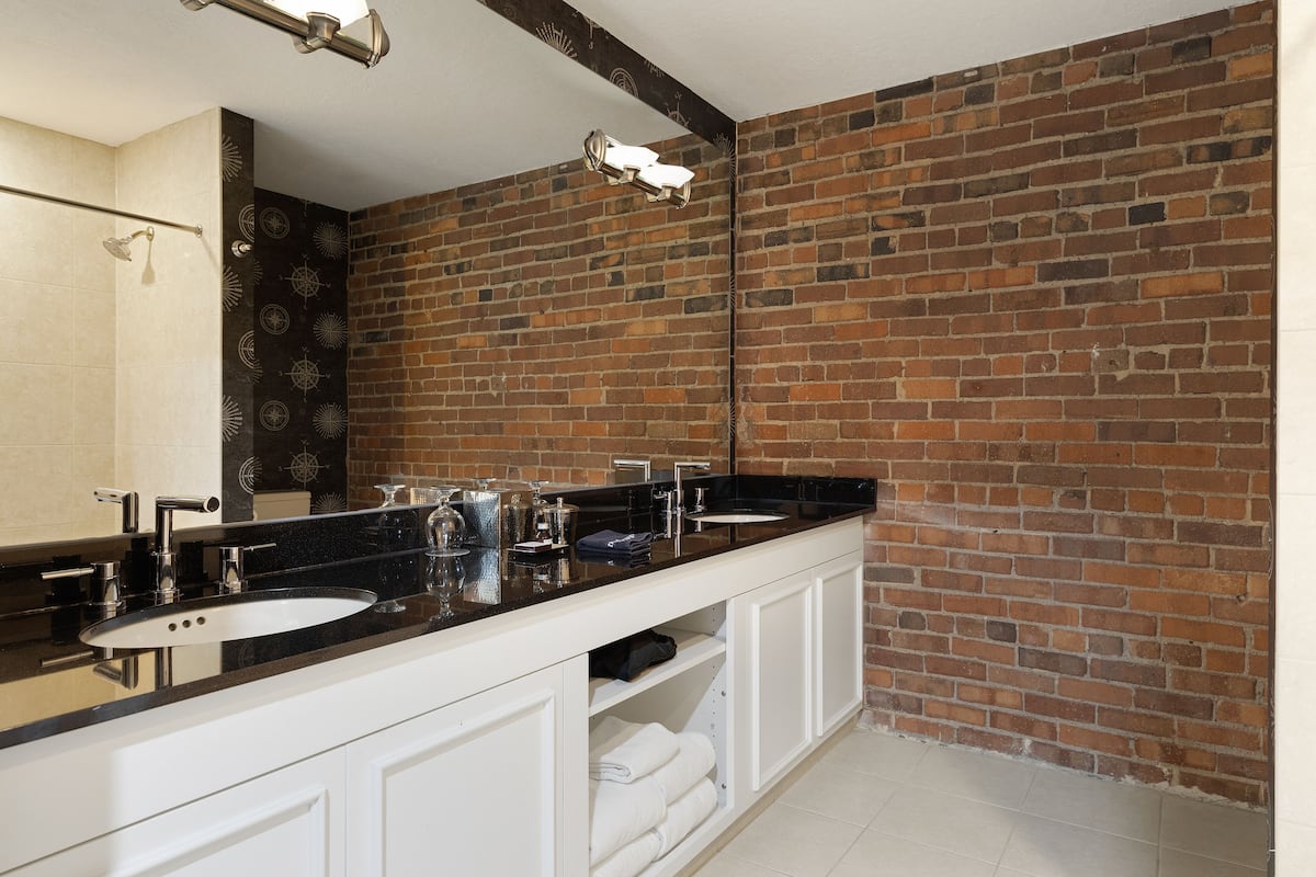 designer toiletries, hair dryer, towels, soap