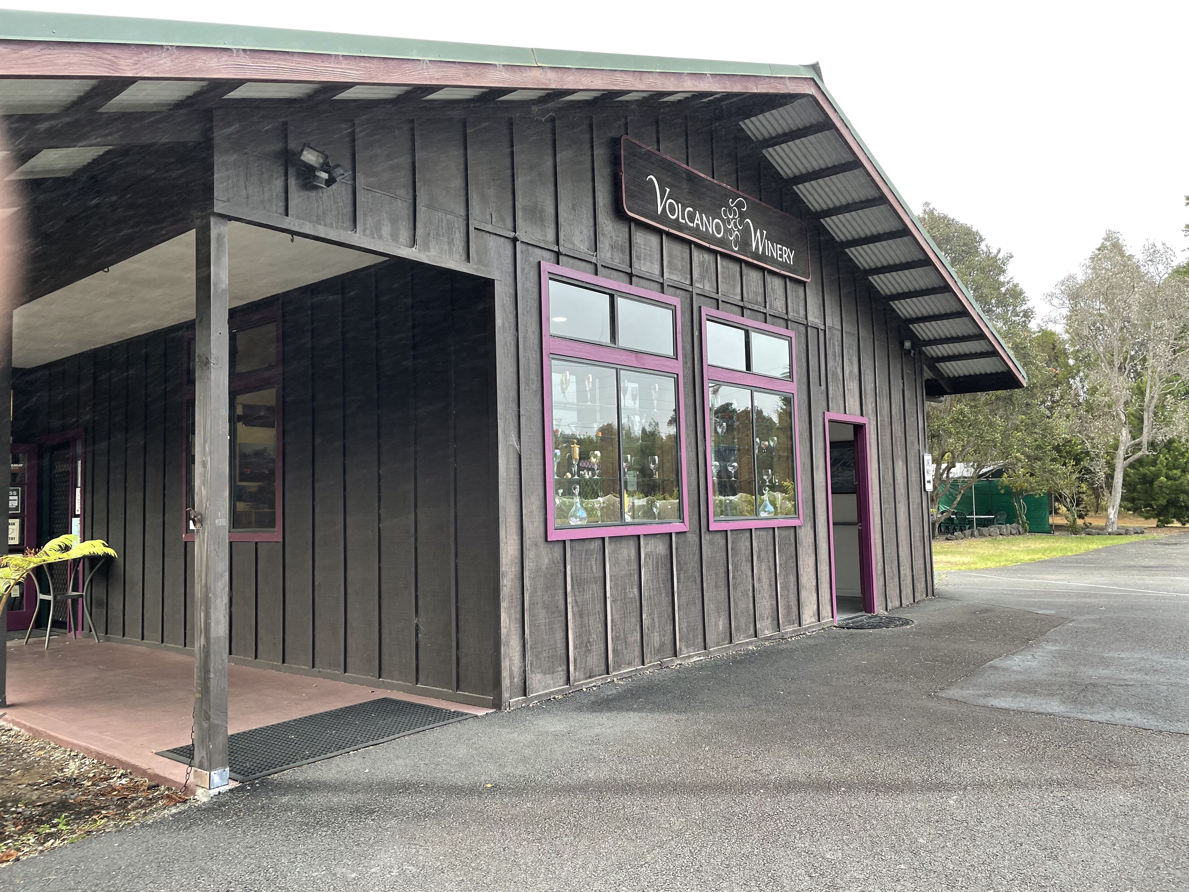 A wooden building with a sign that reads "Volcano Winery."
