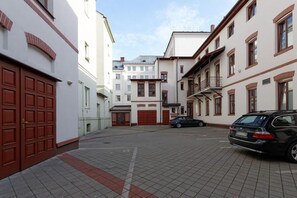 Stroll through historic streets lined with traditional European-style buildings featuring symmetrical facades and decorative brickwork.