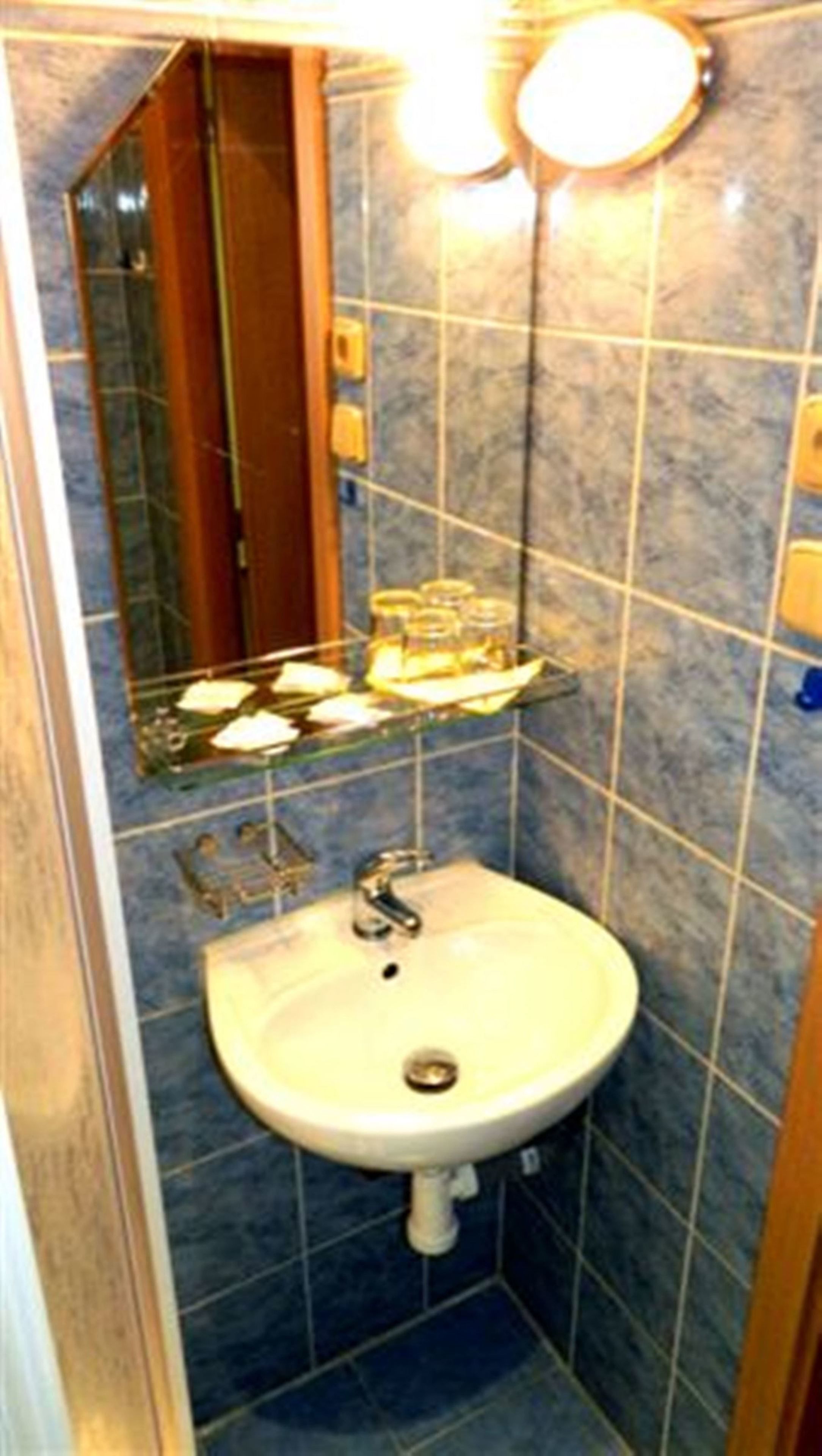 family triple room, private bathroom | bathroom sink