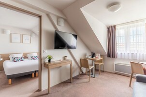 Apartamento, 1 habitación | Zona de estar | Una televisión de pantalla plana