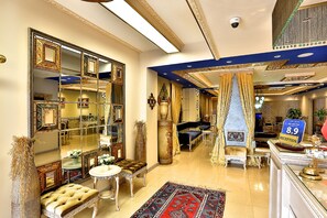 A luxurious hotel lobby with ornate mirrors, plush seating, and a reception desk. - Edibe Sultan Hotel (Istanbul)