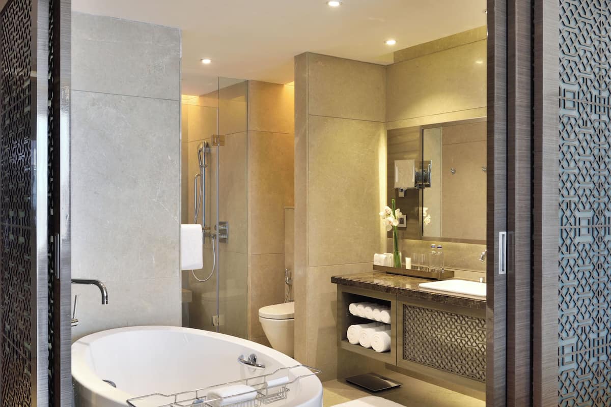 separate bathtub and shower, designer toiletries, hair dryer, bathrobes