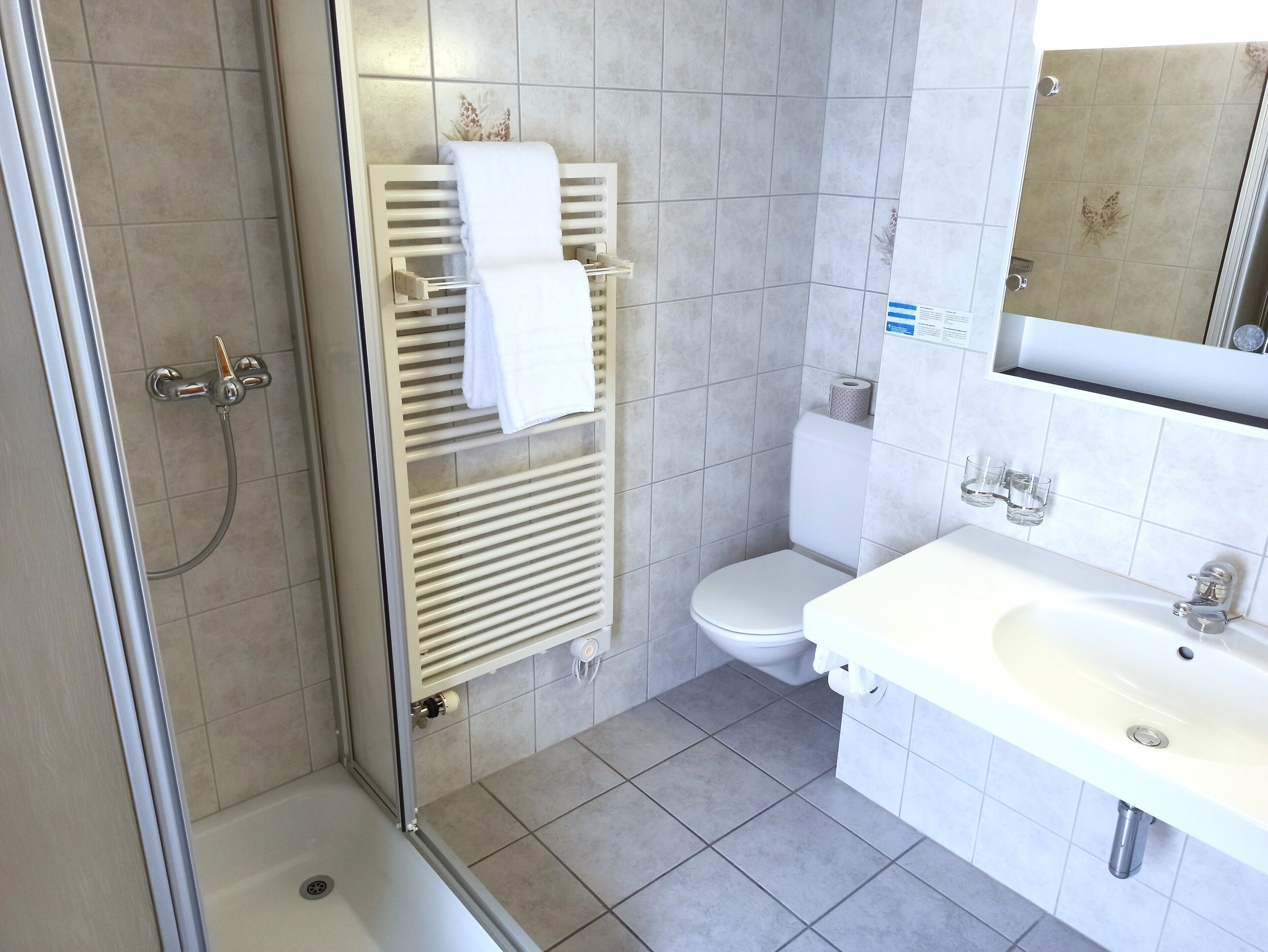 standard double room | bathroom | deep-soaking bathtub, rainfall showerhead, hair dryer, towels
