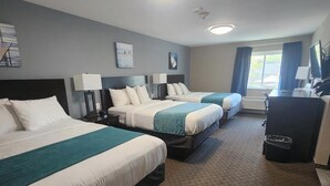 A hotel room with two beds, a desk, a chair, and a TV. - Put-In-Bay Resort and Conference Center (Put-in-Bay)