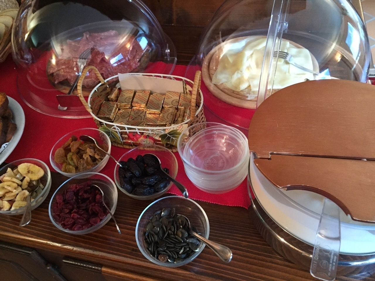 A buffet table with various food items and containers.