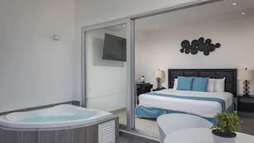 Luxury Room, 1 King Bed, Hot Tub, Sea View | Minibar, in-room safe, individually decorated, individually furnished
