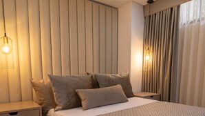 Familieleilighet | Minibar, safe på rommet, wi-fi (inkludert) og sengetøy