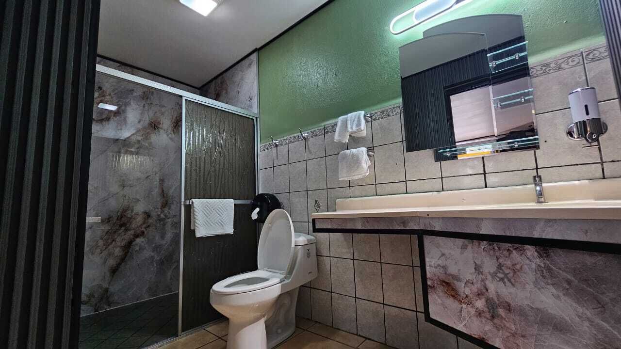 standard room, 2 double beds, pool view | bathroom | shower, free toiletries, hair dryer, towels