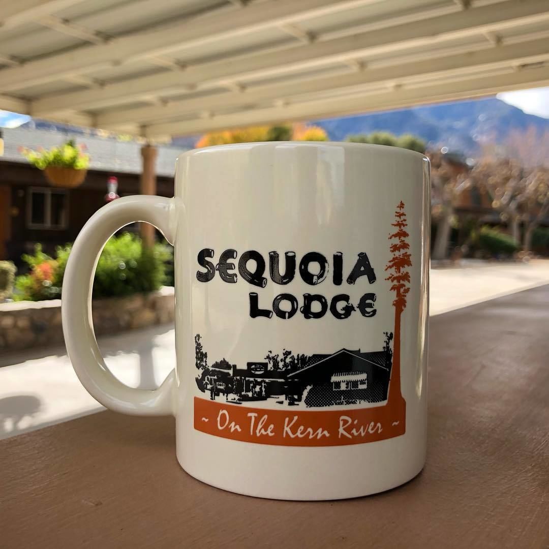 A white mug with "SEQUOIA LODGE" and "On The Kern River" printed on it.