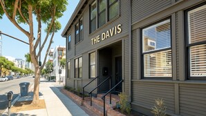 A building named "The Davis" with a modern facade, a brick base, and a staircase leading to the entrance. - The Davis Downtown San Diego (San Diego)
