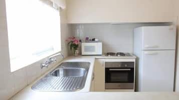 Two Bedroom Apartment | Private kitchen | Fridge, microwave, coffee/tea maker