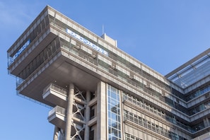 A modern building with multiple balconies and large windows. - Shin-Osaka Youth Hostel (Osaka)