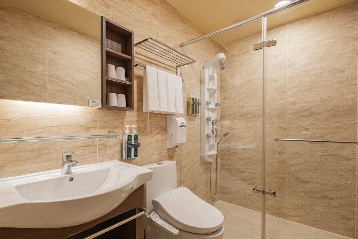 family room | bathroom | separate bathtub and shower, hair dryer, slippers, towels