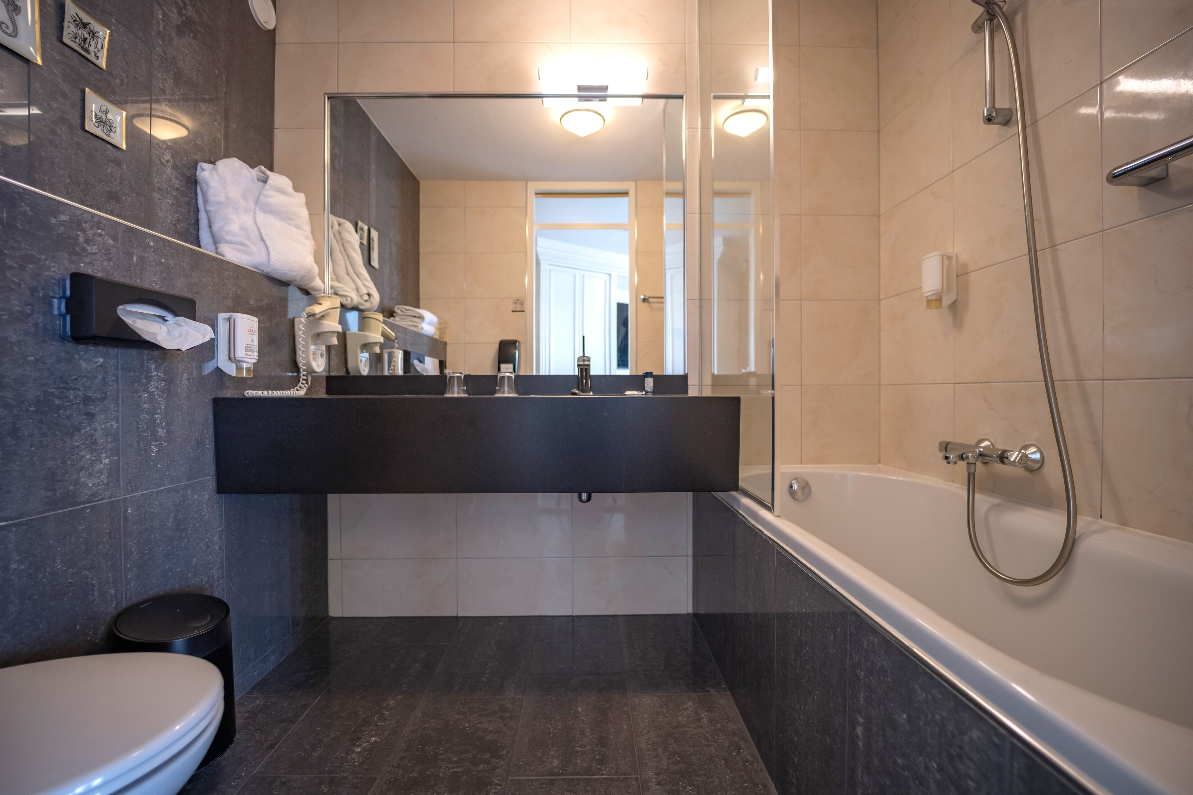 junior suite | bathroom | eco-friendly toiletries, hair dryer, towels