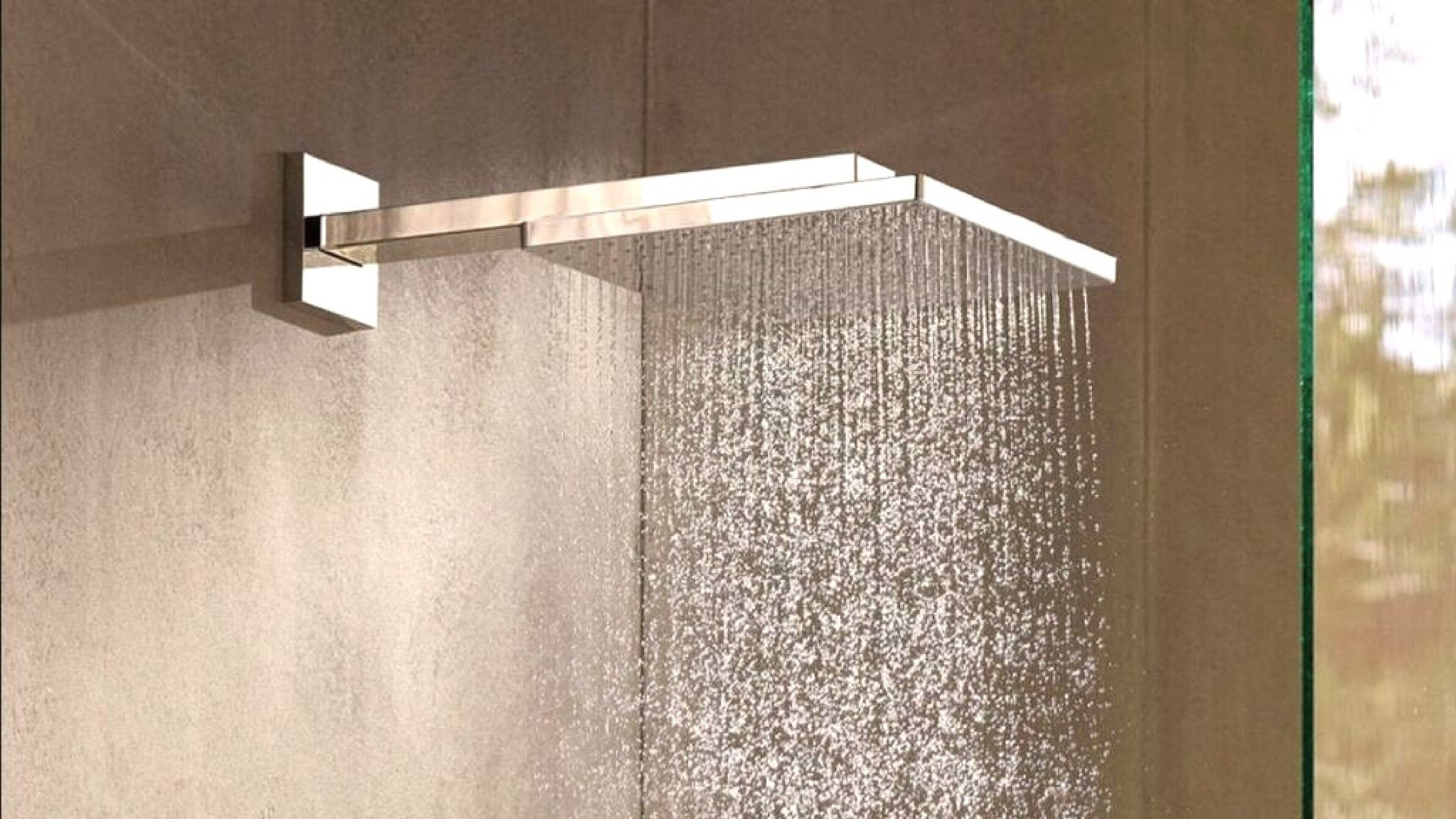 A modern shower with a horizontal design and a visible water flow.
