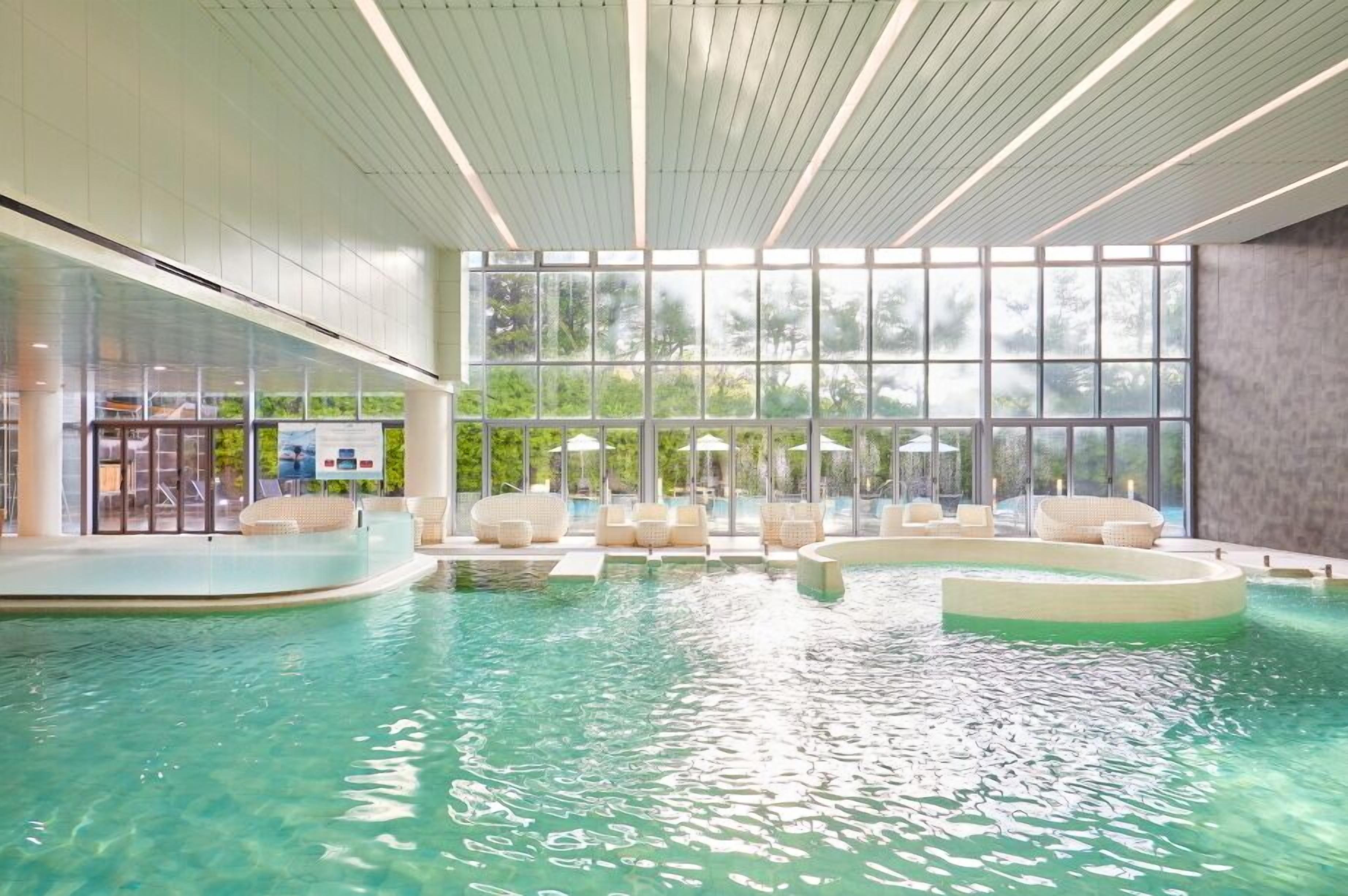 indoor pool, seasonal outdoor pool, pool umbrellas, pool loungers
