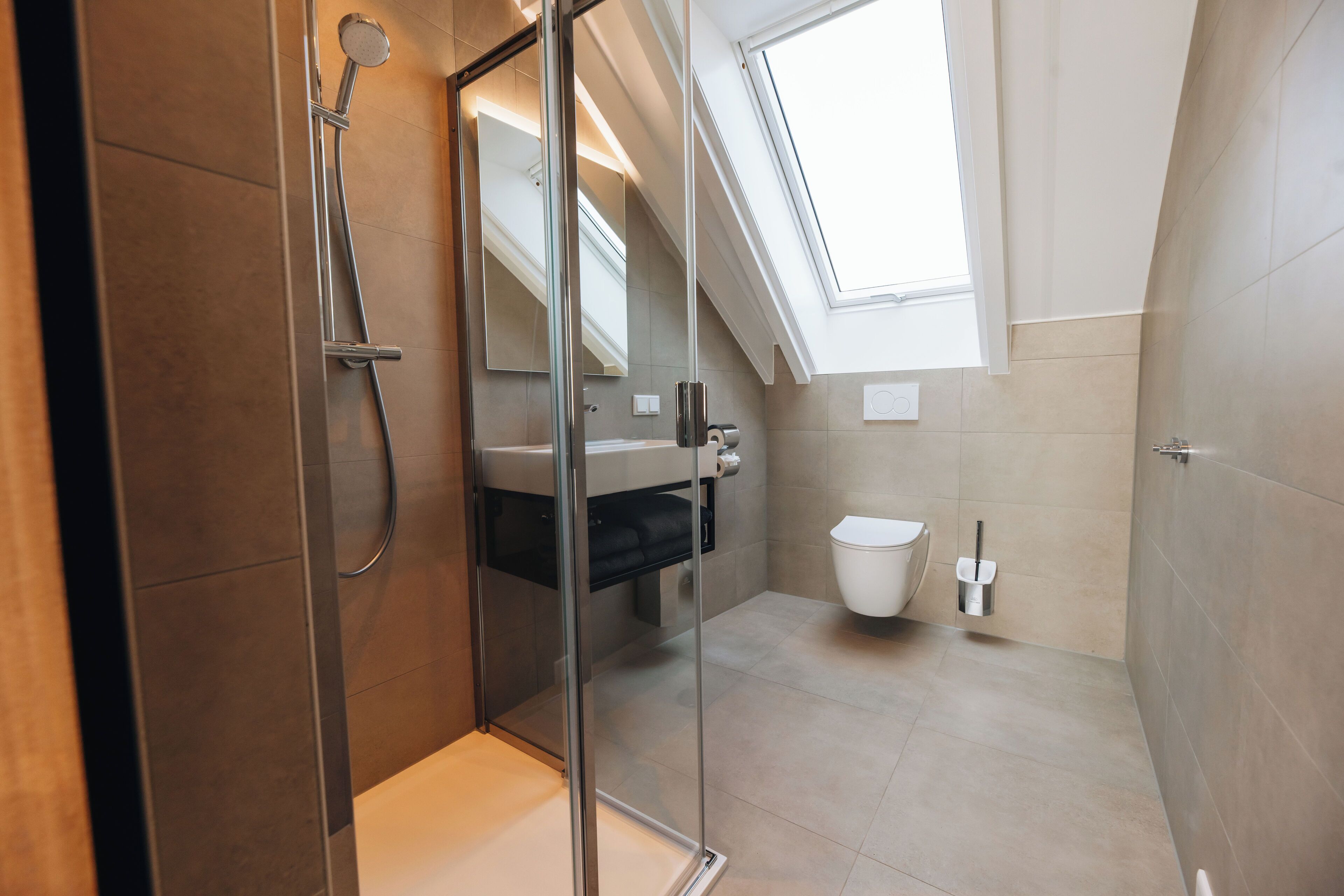 deluxe studio | bathroom | shower, hair dryer, towels, soap